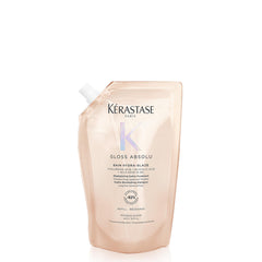 KÉRASTASE Gloss Absolu shampoo bottle closeup for glossy, frizz-controlled styling.