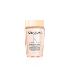 KÉRASTASE Gloss Absolu shampoo bottle close-up shows glossy shine potential.