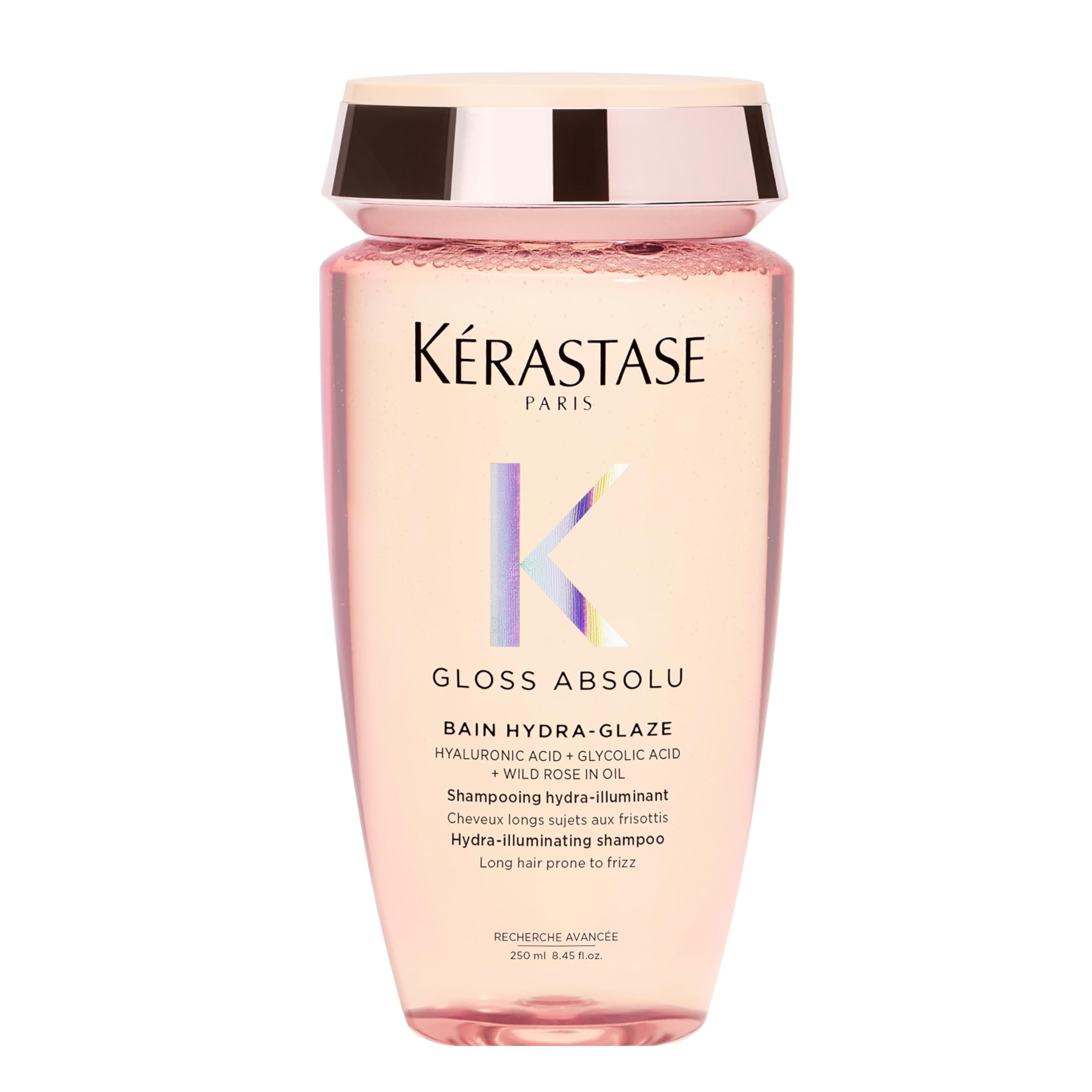 Kerastase Gloss Absolu shampoo bottle pouring for a smooth, glossy cleanse.