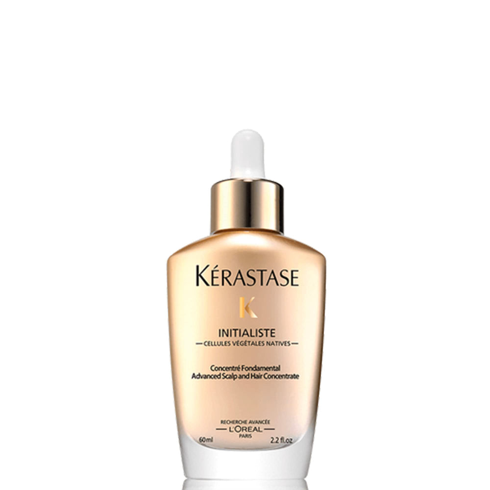 KÉRASTASE Initialiste bottle pour highlights targeted scalp-strengthening care.