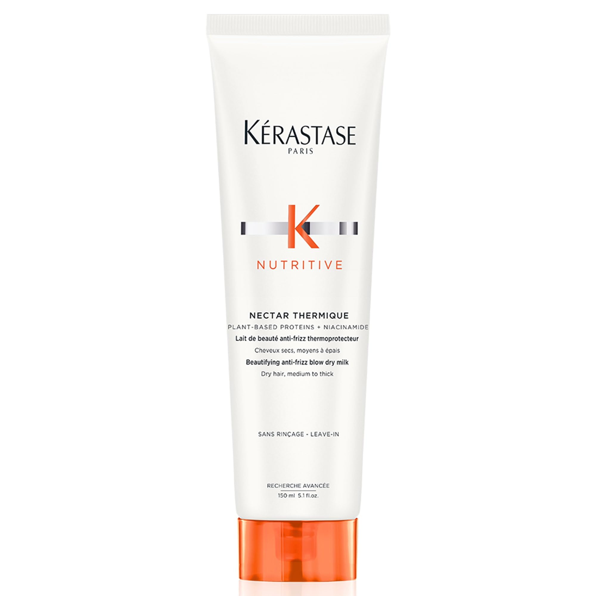 Kérastase Nectar Thermique bottle pour demonstrates heat protection for smooth styling.