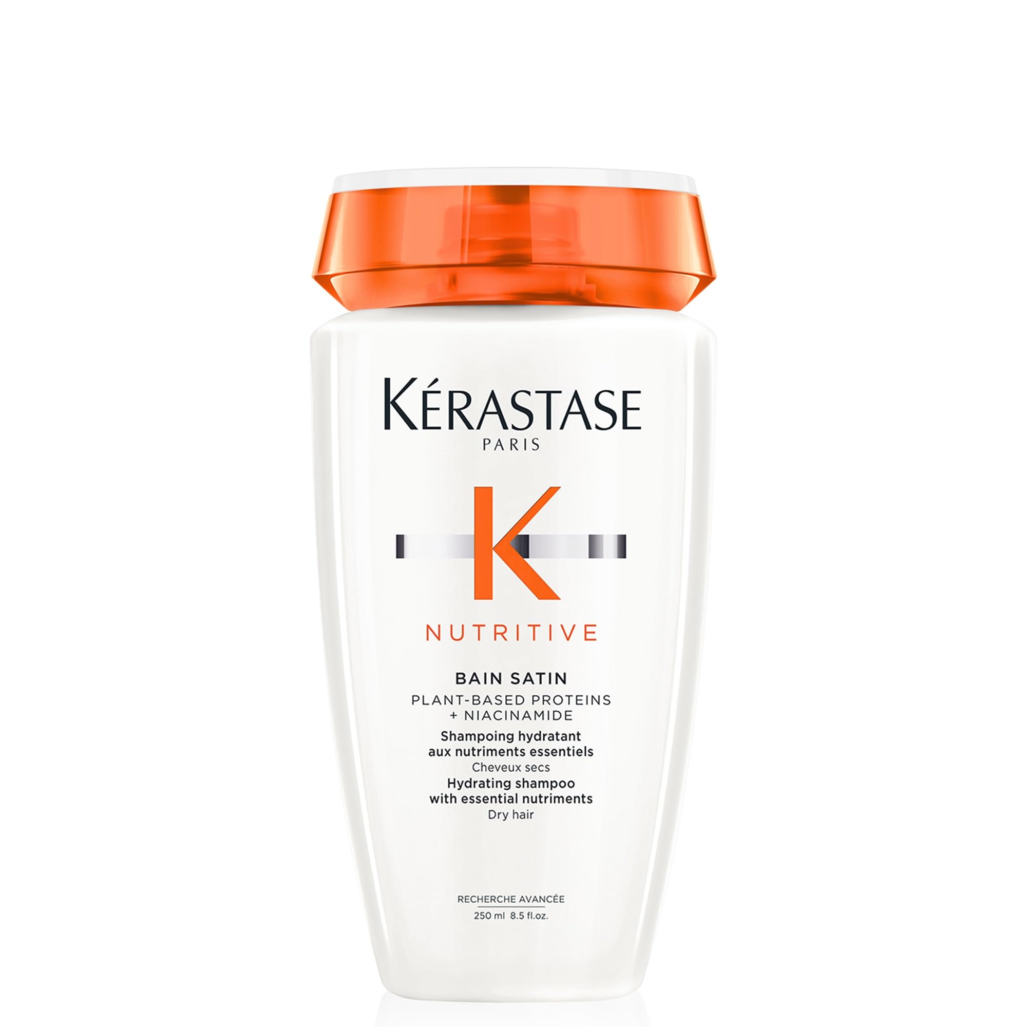 KÉRASTASE Nutritive Gentle Hydrating Shampoo bottle closeup shows nourishing hydration for dry hair