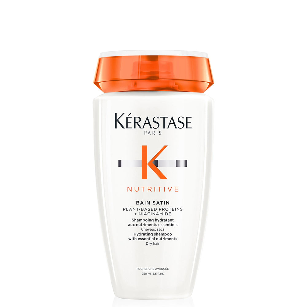 KÉRASTASE Nutritive Gentle Hydrating Shampoo bottle closeup shows nourishing hydration for dry hair
