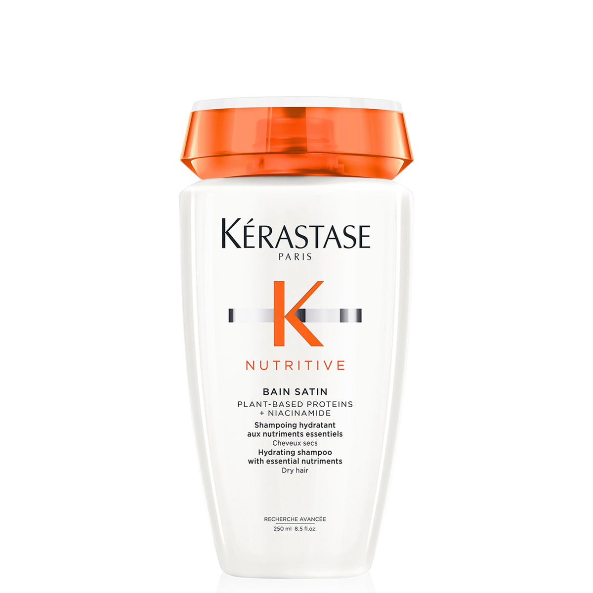 KÉRASTASE Nutritive Gentle Hydrating Shampoo bottle closeup shows nourishing hydration for dry hair