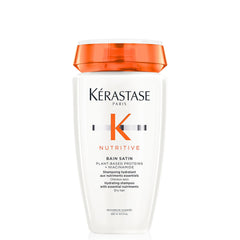 KÉRASTASE Nutritive Gentle Hydrating Shampoo bottle closeup shows nourishing hydration for dry hair