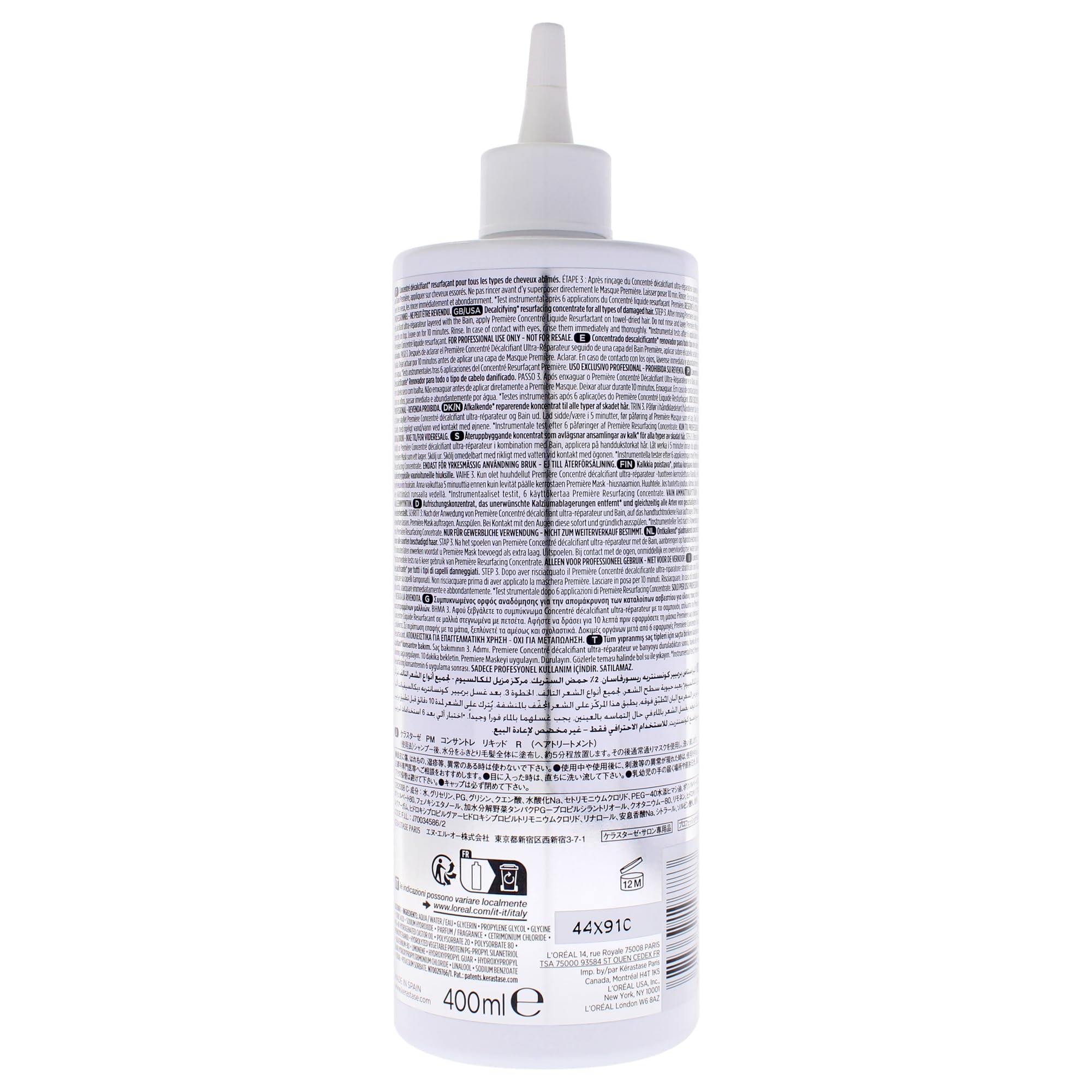 KÉRASTASE concentrate being applied to hair in salon, demonstrating smoother fiber benefit