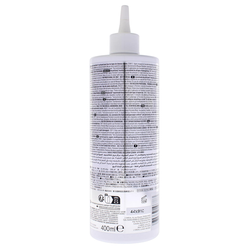 KÉRASTASE concentrate being applied to hair in salon, demonstrating smoother fiber benefit
