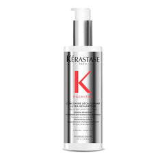 KÉRASTASE Premiere Repair bottle pour showing dual-action cleansing and strengthening.