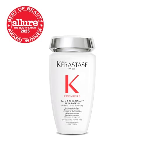 Close-up of paste label on kerastase premiere bottle highlighting citric acid benefits.