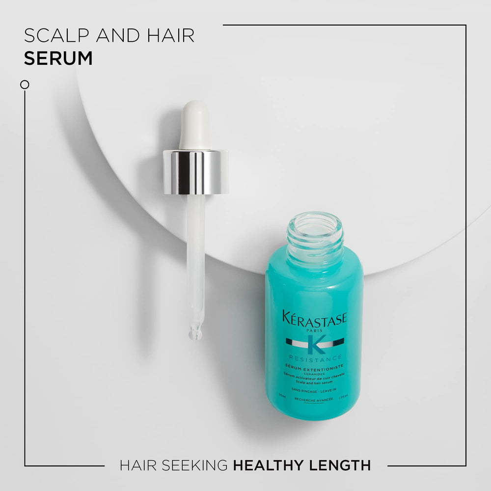 Kerastase Resistance Extentioniste serum being applied to the scalp during massage.