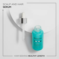 Kerastase Resistance Extentioniste serum being applied to the scalp during massage.