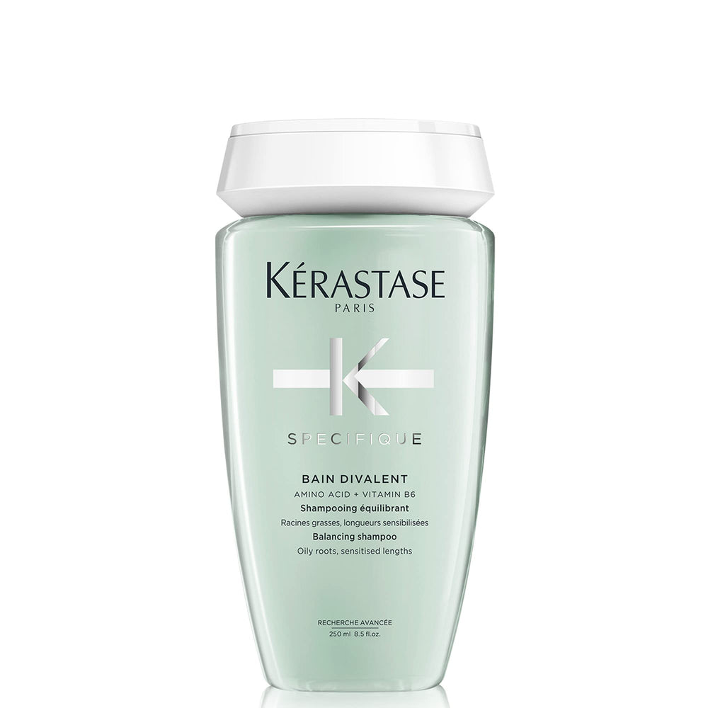 KÉRASTASE Specifique Balancing Shampoo bottle pour shows oil-control action for refreshed scalp.