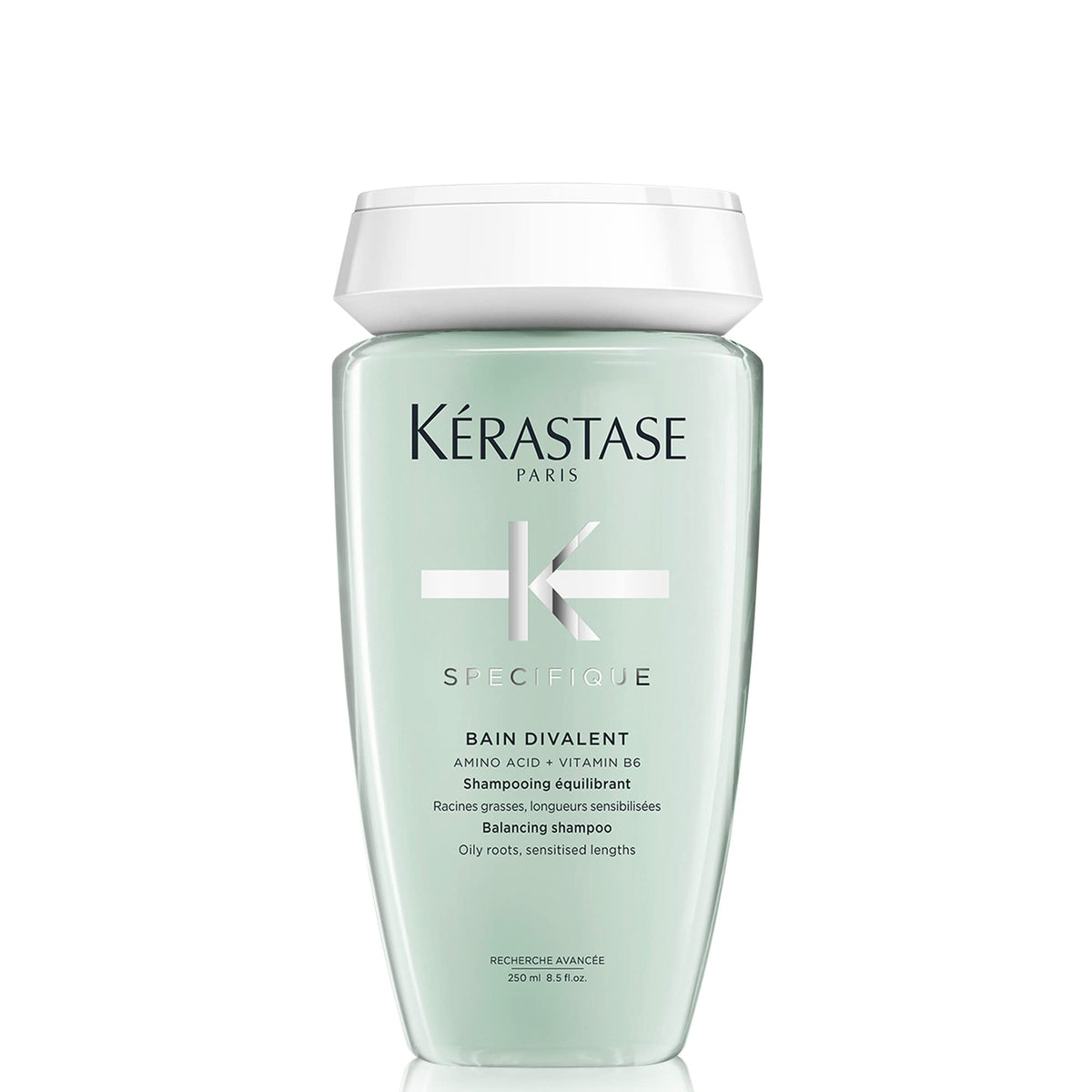 KÉRASTASE Specifique Balancing Shampoo bottle pour shows oil-control action for refreshed scalp.