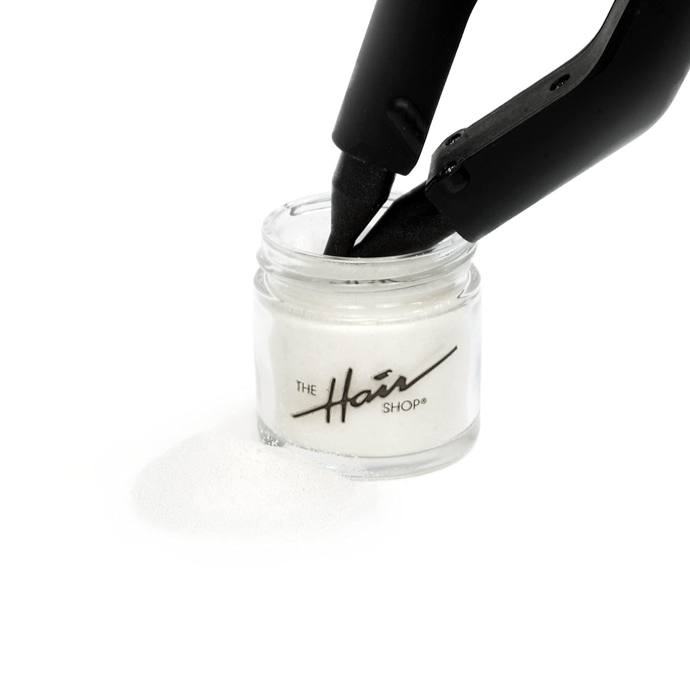 Keratin glue powder closeup highlighting smooth bonding for retipping.