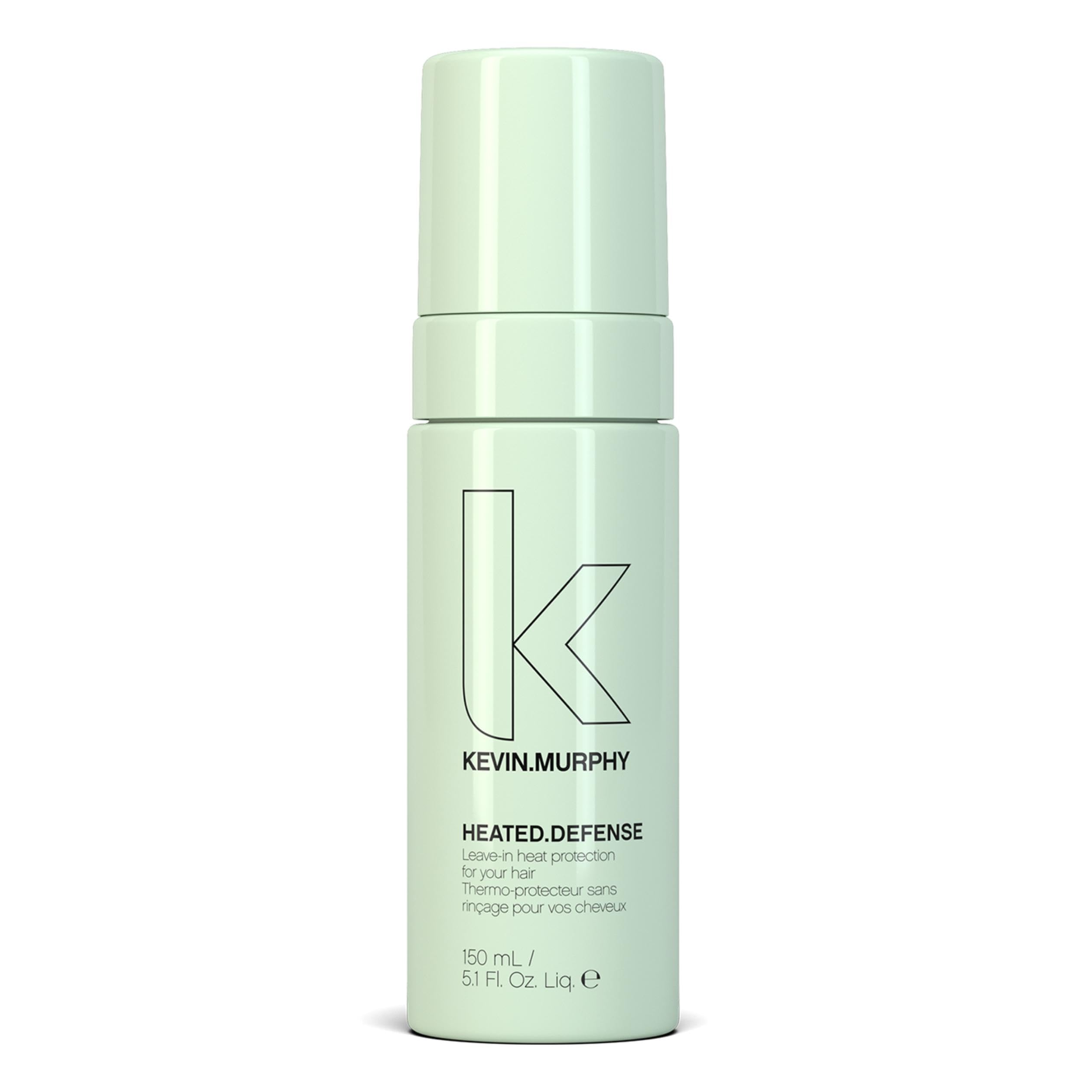 KEVIN.MURPHY HEATED.DEFENSE bottle pour shows weightless heat protection for all hair types.