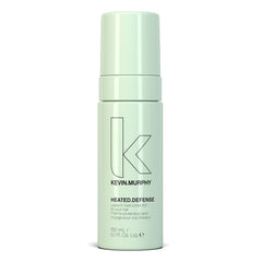 KEVIN.MURPHY HEATED.DEFENSE bottle pour shows weightless heat protection for all hair types.