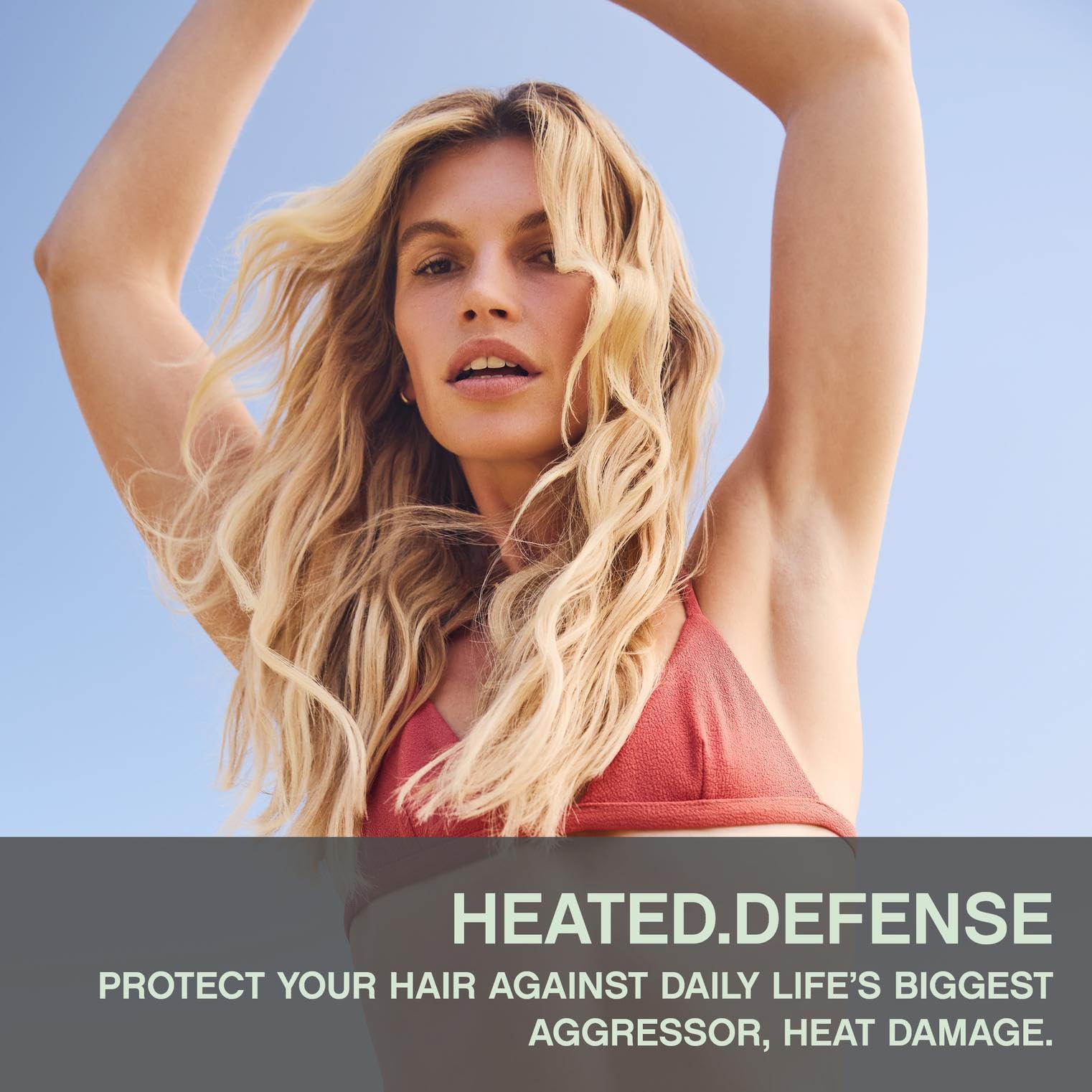 KEVIN.MURPHY HEATED.DEFENSE foam application demonstrates detangling and smoothing on styled strands.