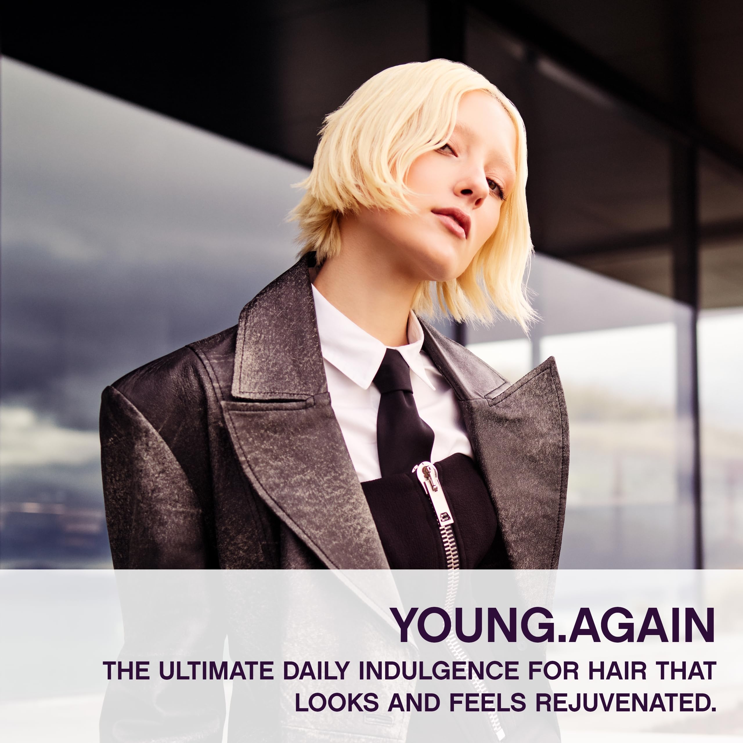 Kevin Murphy Young Again applying hair demonstrates easy use for elasticity.