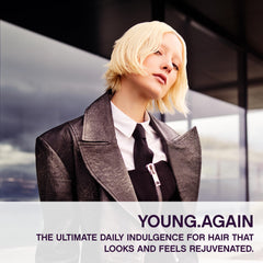Kevin Murphy Young Again applying hair demonstrates easy use for elasticity.