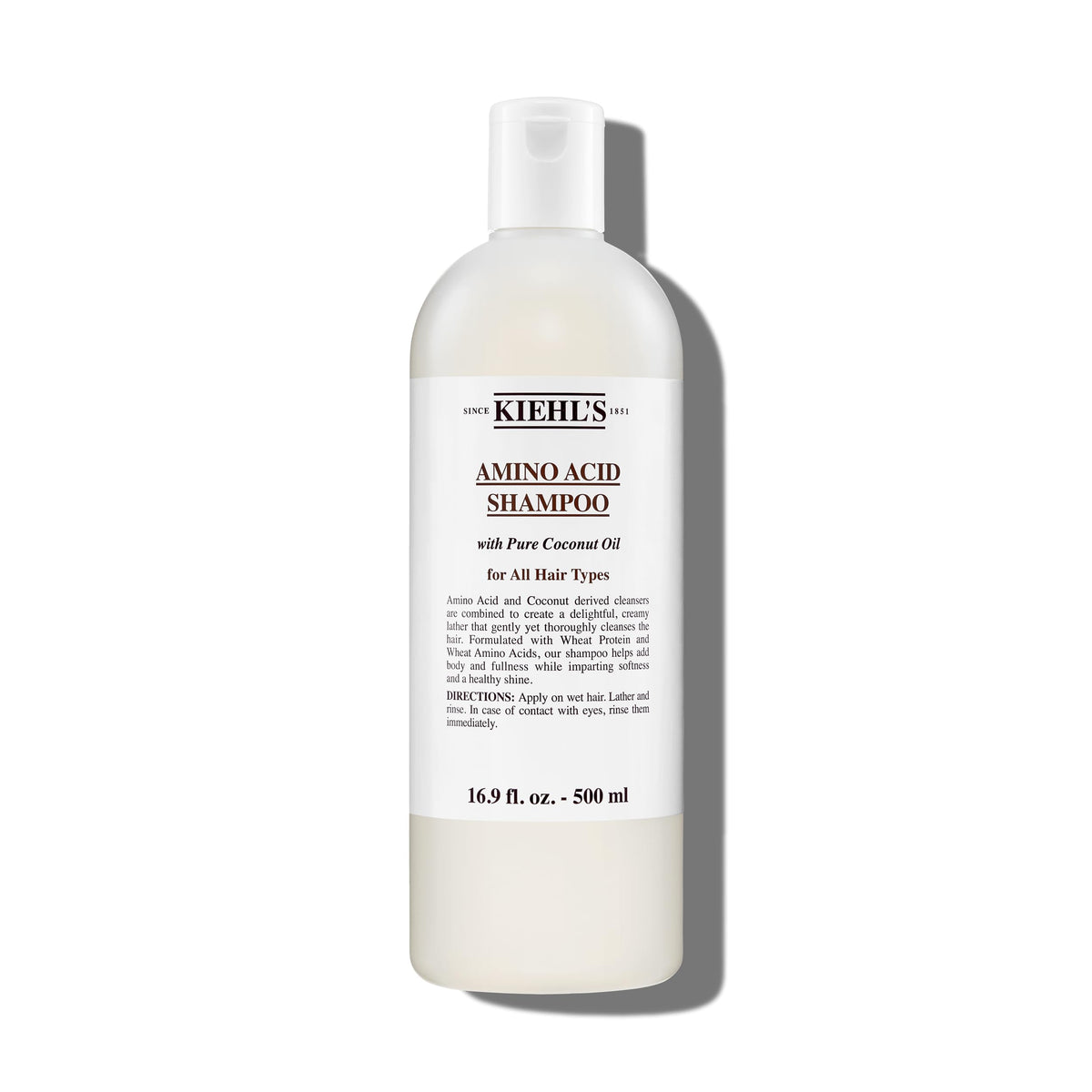 Kiehl's Amino Acid Shampoo bottle pour for daily cleansing and nourishment.
