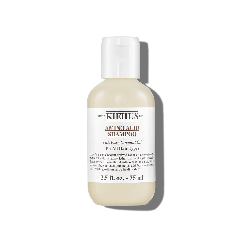 Kiehl's Amino Acid Shampoo bottle pour showcases lightweight cleansing for daily use.