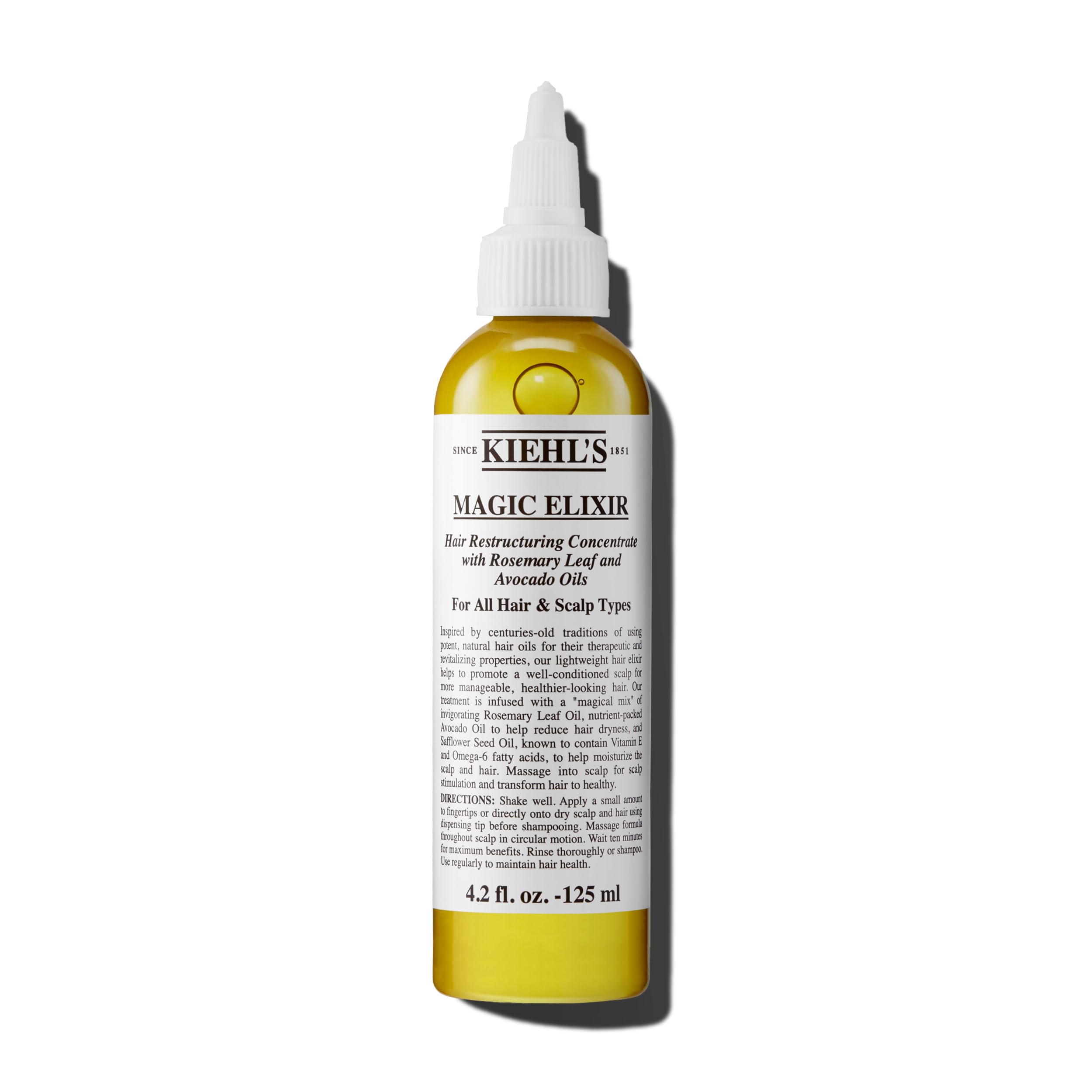 Kiehl's Magic Elixir scalp oil bottle pour shows lightweight pre-shampoo nourishment