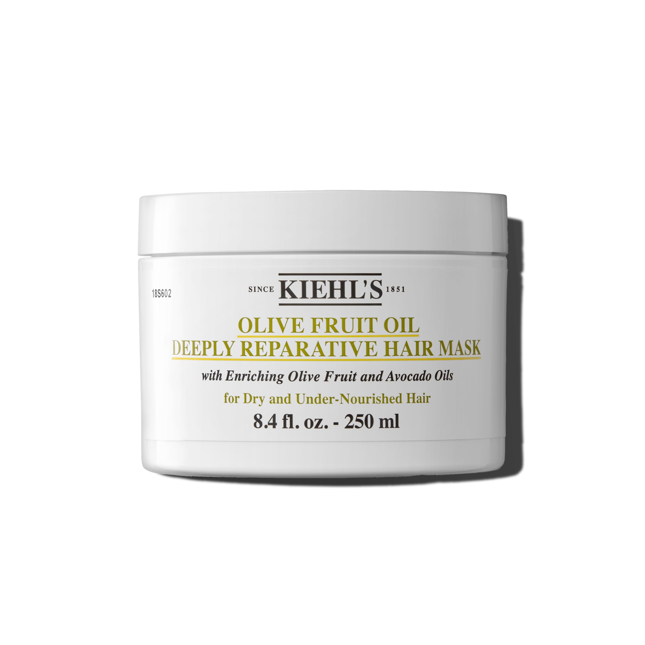 Kiehl's Olive Fruit Oil Deeply Reparative Hair Mask bottle closeup promotes moisture for dry hair.