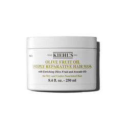 Kiehl's Olive Fruit Oil Deeply Reparative Hair Mask bottle closeup promotes moisture for dry hair.