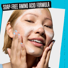 Kiehl's Ultra Facial Barrier-Hydrating Cleanser fingertips applying cream-to-foam.