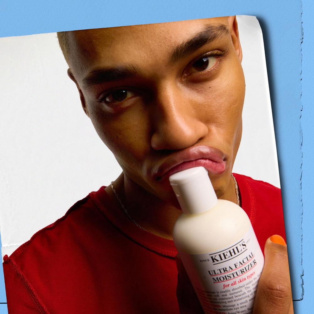 Kiehl's Ultra Facial Moisturizer on hand shows daily skin care routine.