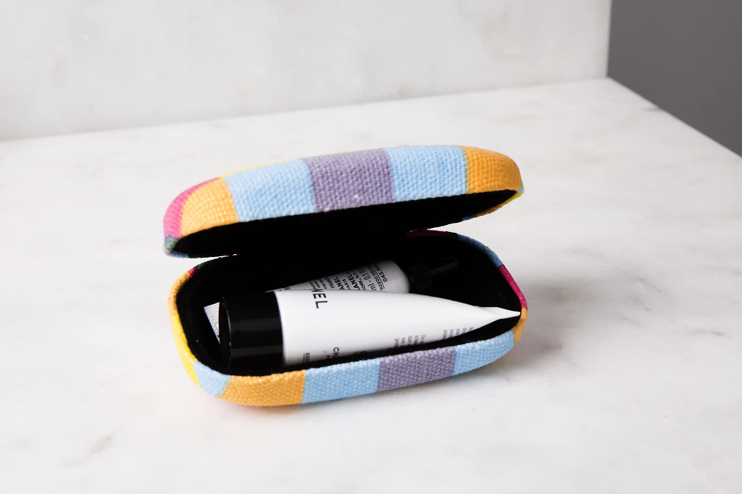 Kikkerland plaid case protects watches and small electronics with velvet lining.