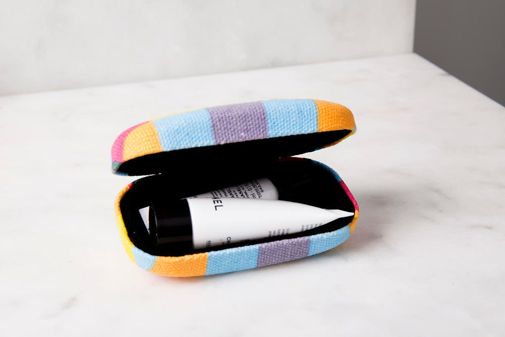 Kikkerland plaid case protects watches and small electronics with velvet lining.