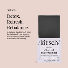 Kitsch charcoal soap bar on a wet sink demonstrates ready-to-use cleansing option.