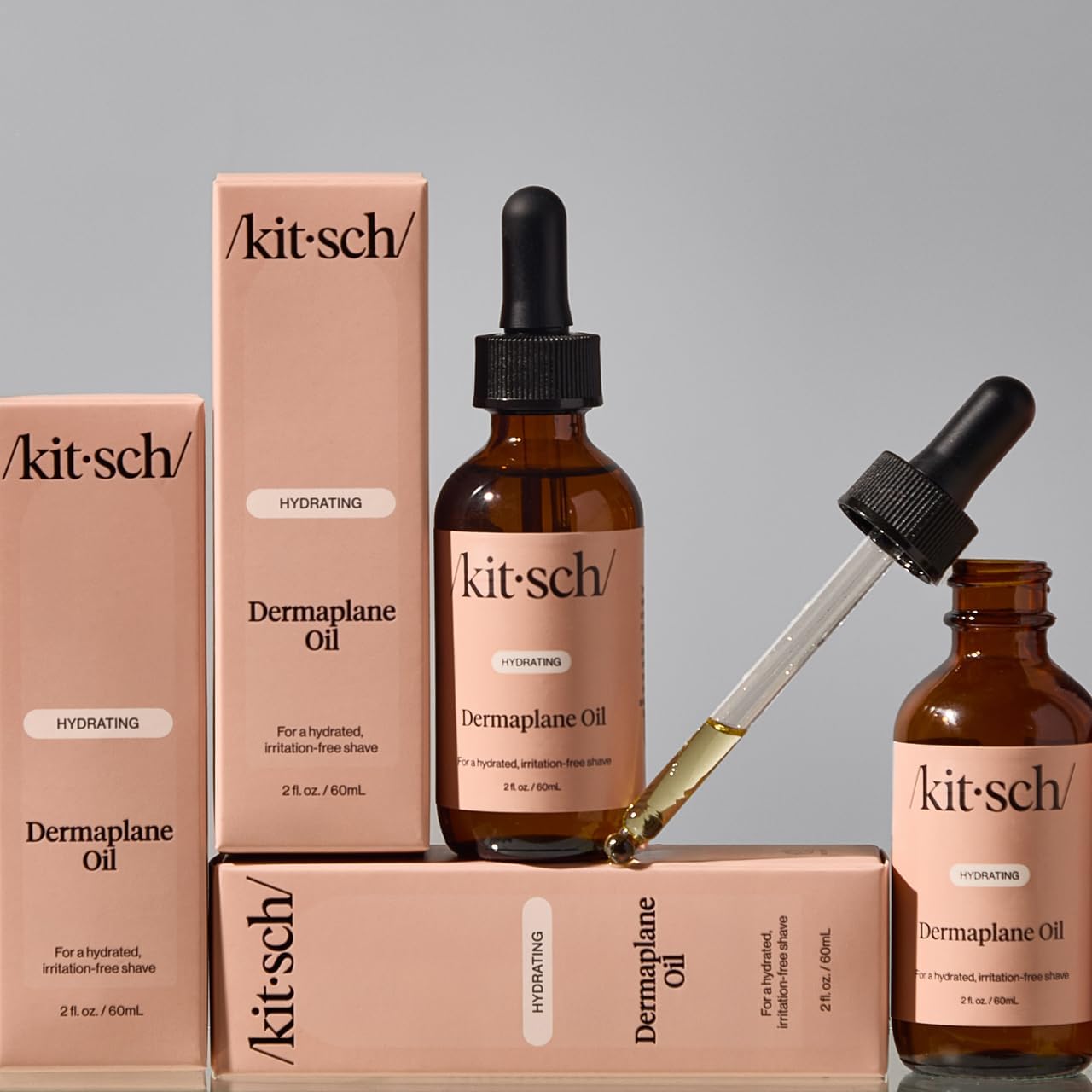 Kitsch Dermaplane oil packaging and label highlighting versatile use.