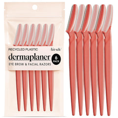 Kitsch Dermaplane Razor packaging in coral highlights eco-friendly, travel-ready skincare set.