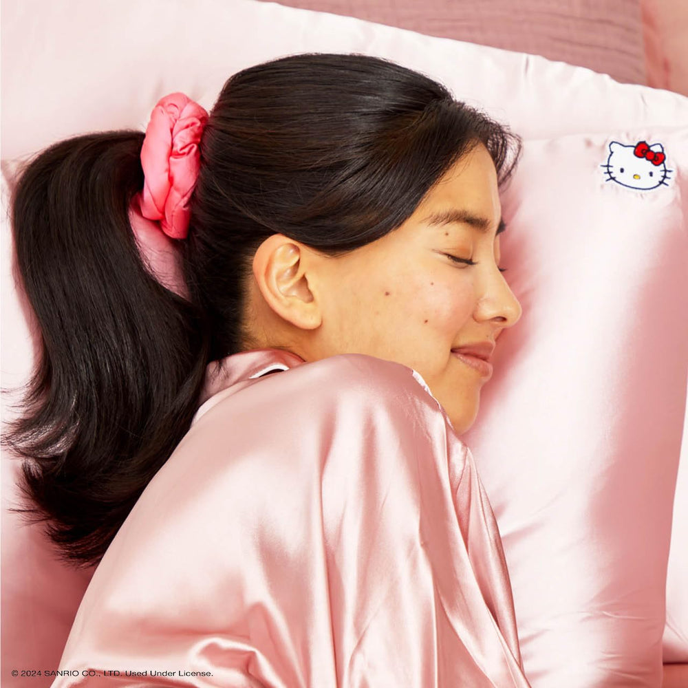 Kitsch Hello Kitty satin scrunchies styled into a neat bun.