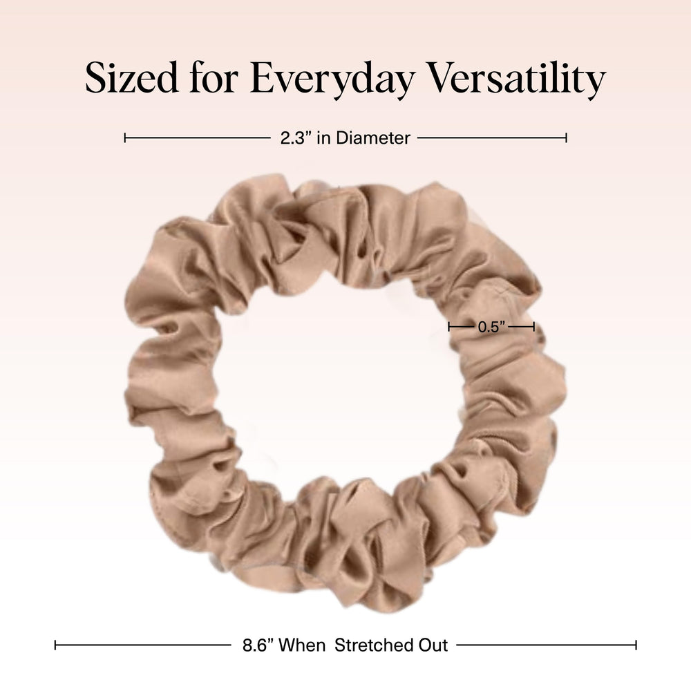 Kitsch satin scrunchies worn as a chic bun accessory for secure, frizz-free day styling.