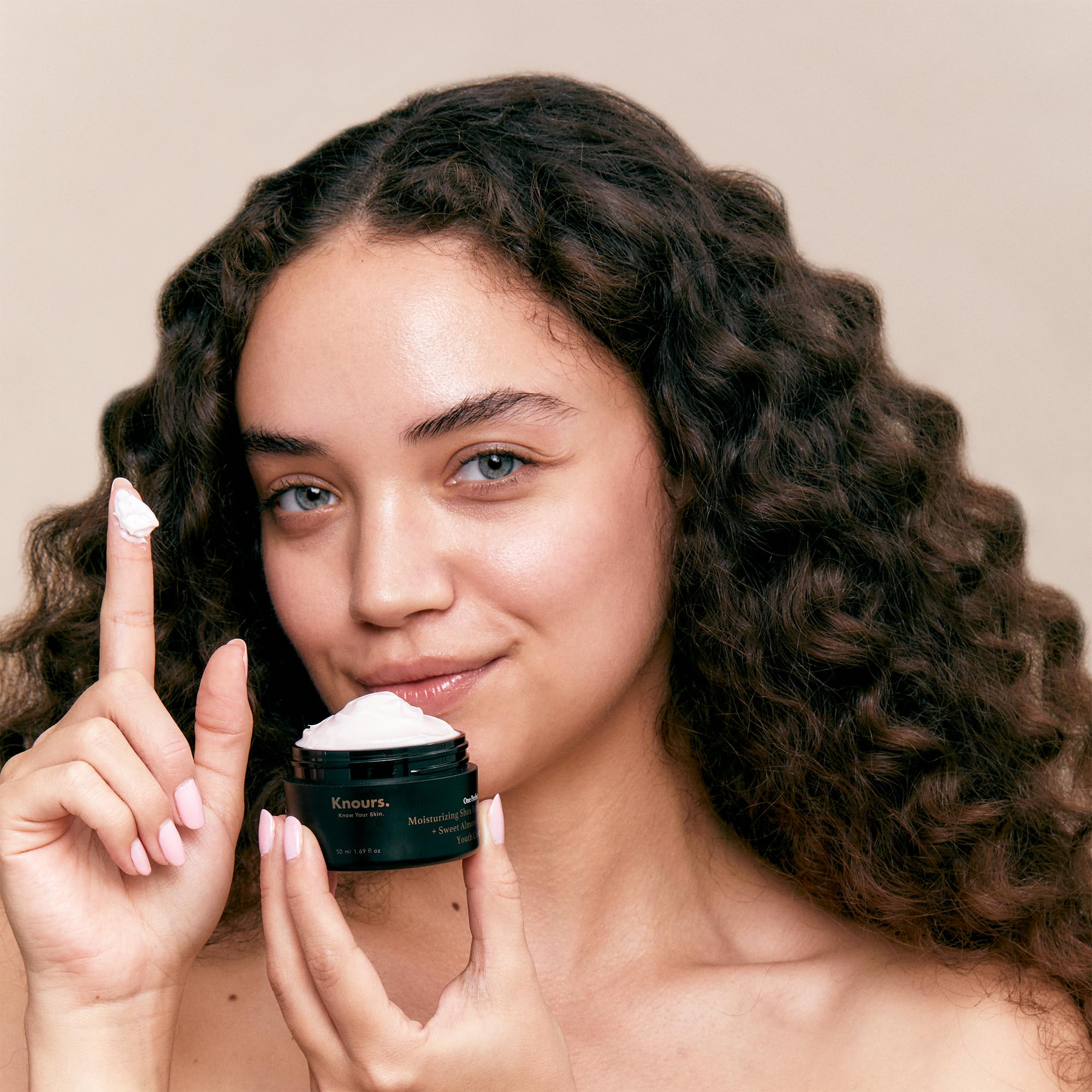 Knours One Perfect Youth Cream jar showing creamy texture for nourishment.