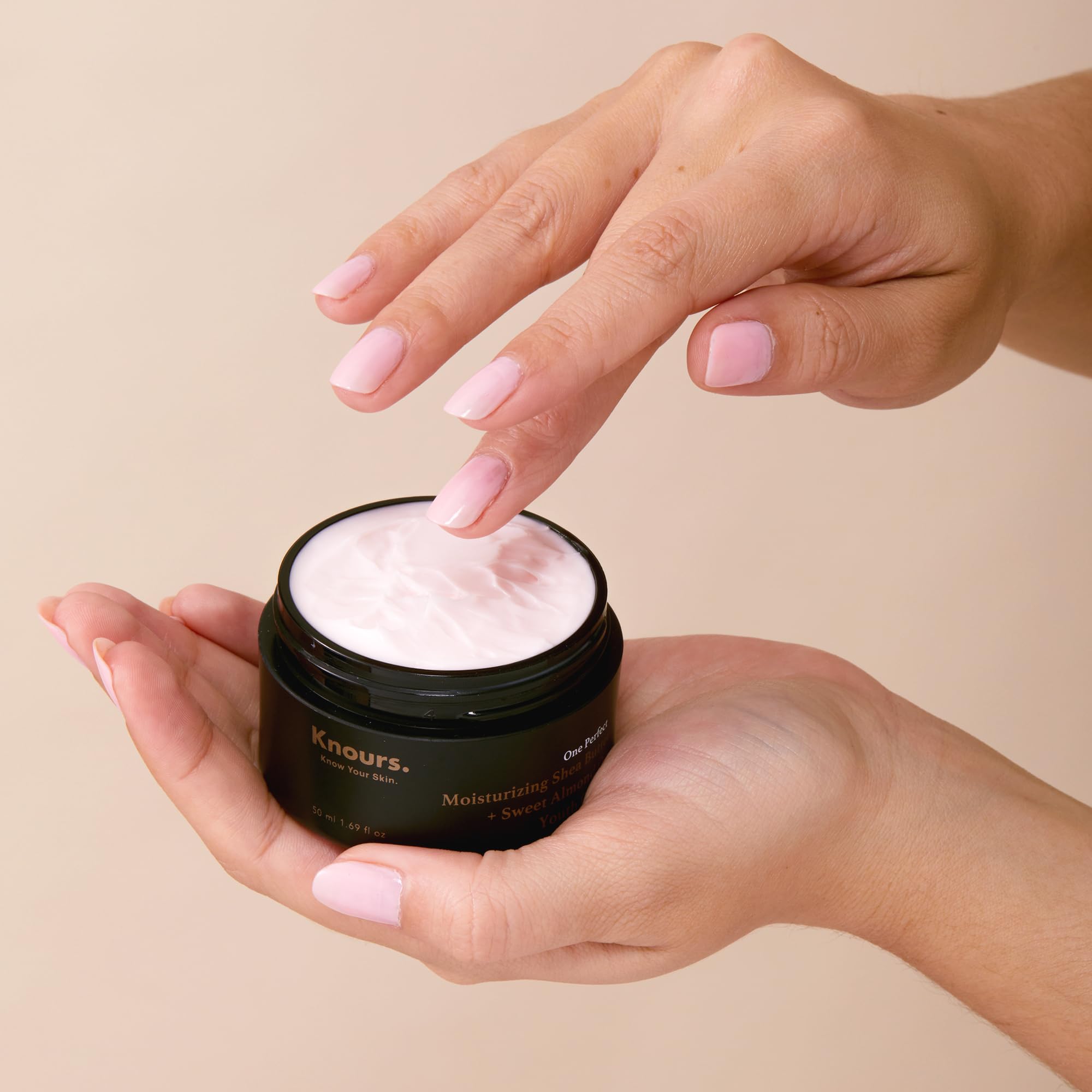 Knours cream being applied to skin for hydration and balance.