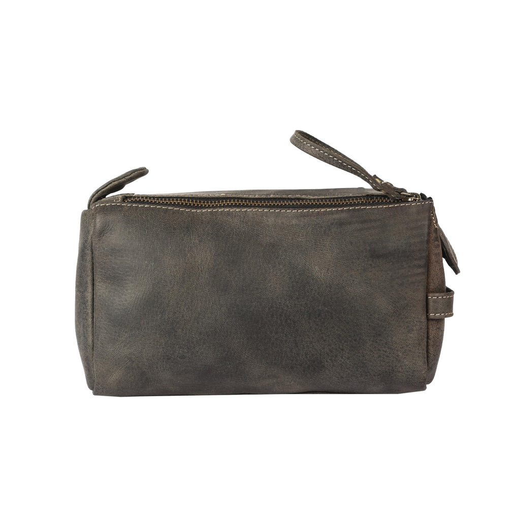 KomalC buffalo leather Dopp kit stitching close-up emphasizes craftsmanship.
