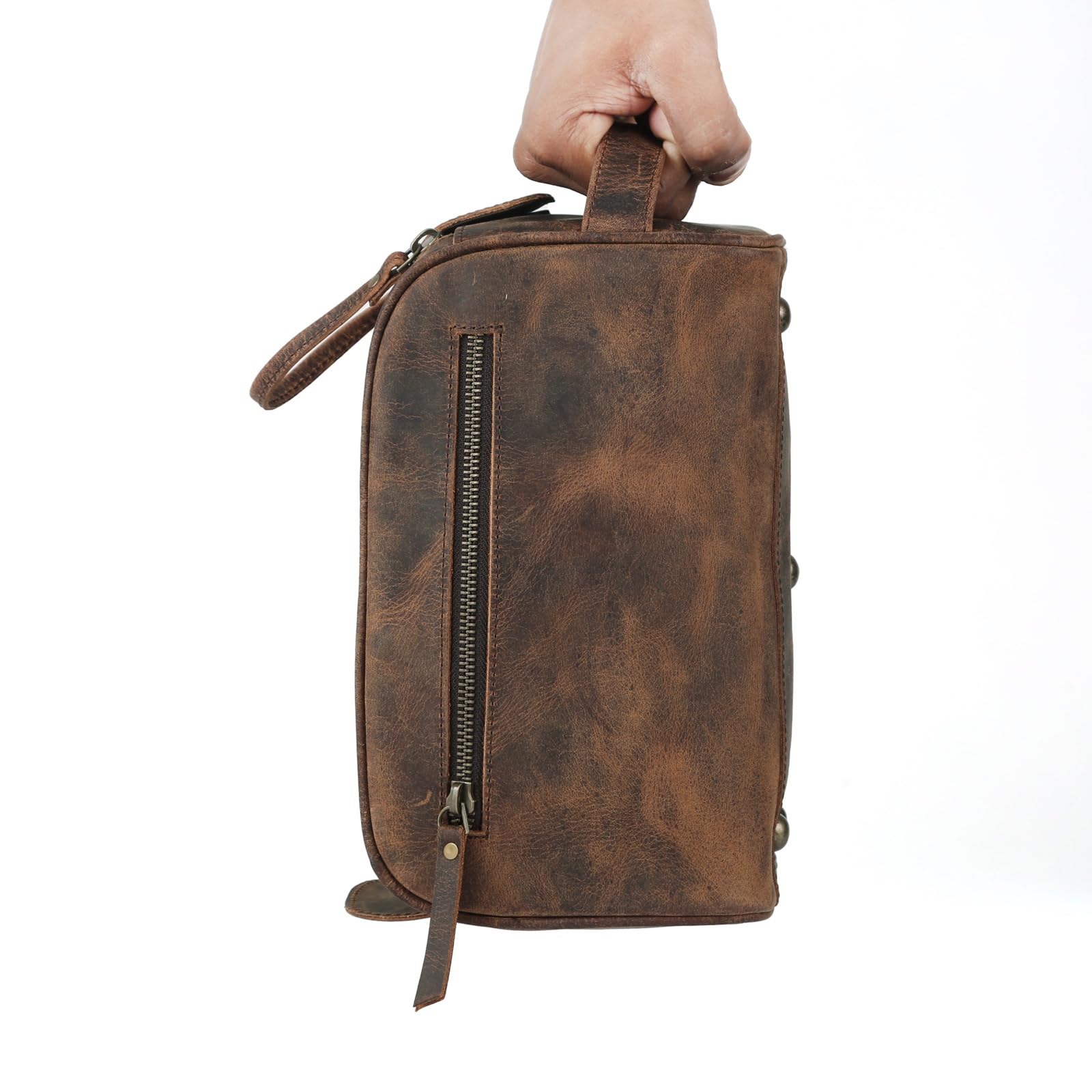 KomalC buffalo leather interior with water-resistant lining protecting contents.