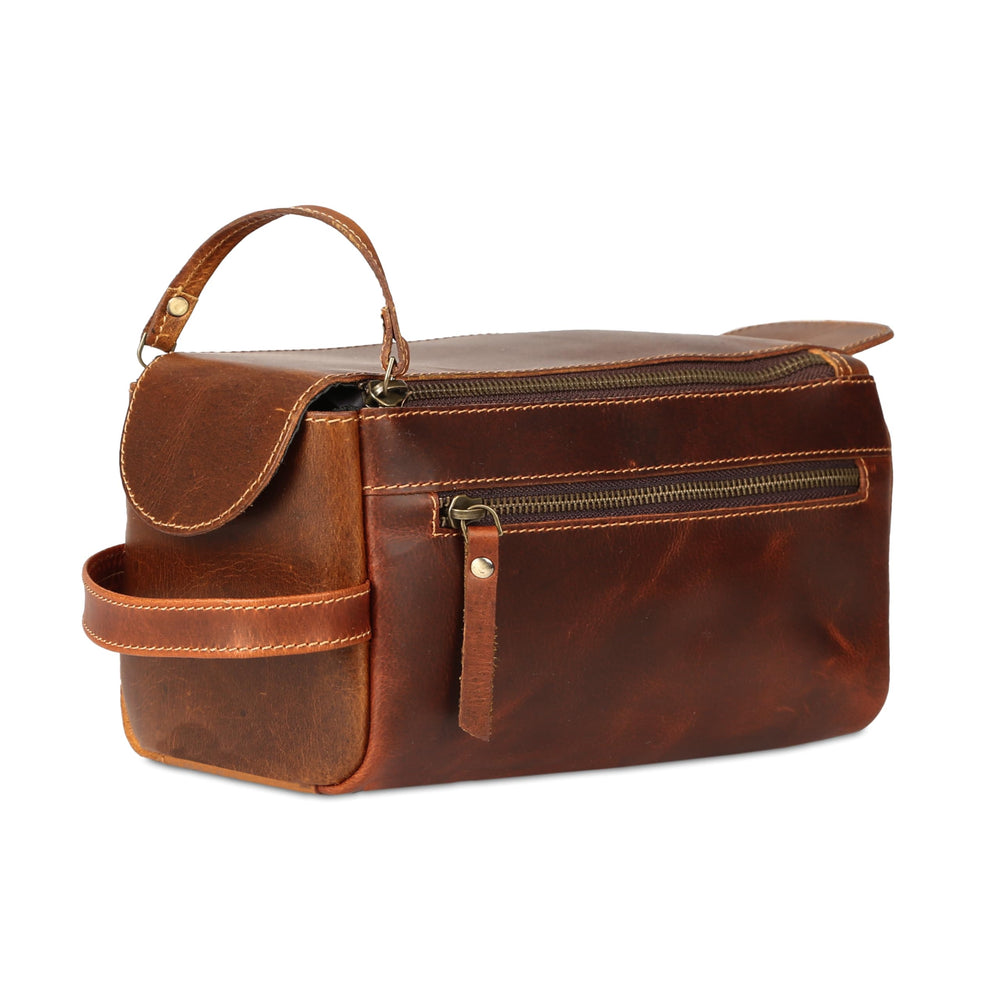 KomalC premium buffalo leather toiletry bag front view in distressed orange tan for travel organization
