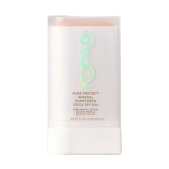 Kopari Pure Protect sunscreen stick applying smoothly for clear face coverage.