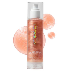 Kopari Sun Shield Body Glow bottle with rose gold shimmer and SPF 45 protection