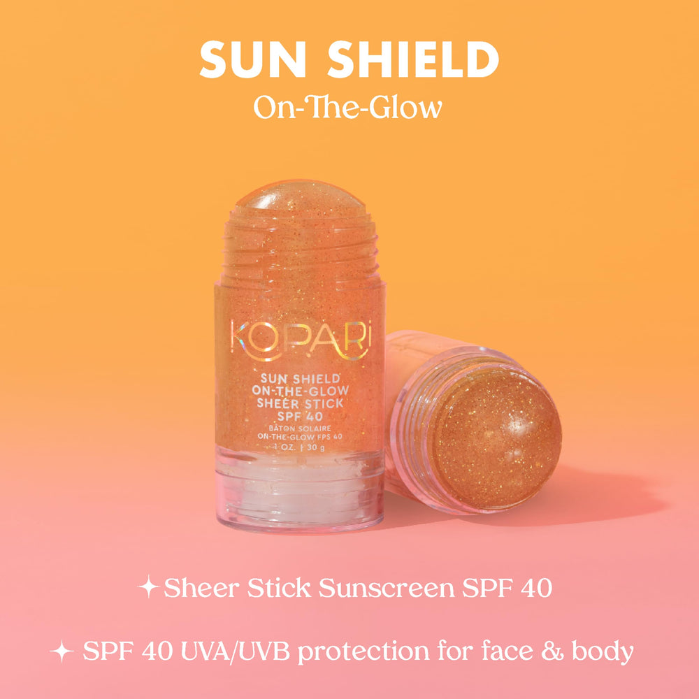 Kopari Sun Shield On-The-Glow stick applied to arms for broad protection