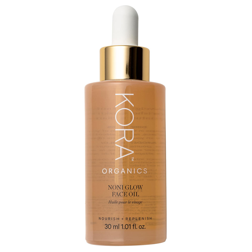 KORA Organics Noni Glow bottle pour for seamless daily facial oil application.