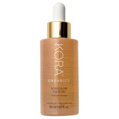 KORA Organics Noni Glow bottle pour for seamless daily facial oil application.