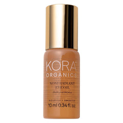 KORA Organics Noni Radiant Eye Oil Roller bottle delivers lightweight hydration for under-eye glow.