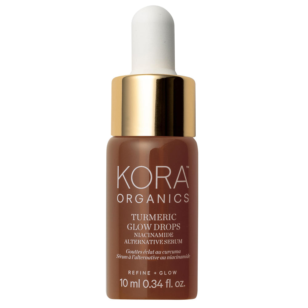 KORA Organics Turmeric Glow Drops bottle demonstrates radiant hydration for dewy skin.