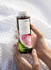 KORRES Renewing Body Cleanser foam lather on skin delivering gentle cleansing.